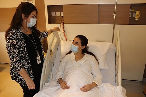 Dr Leanne Bricker with Nour SaadAllah Jabour, mother of the baby who received the 100th transfusion at Abu Dhabi's Corniche Hospital.