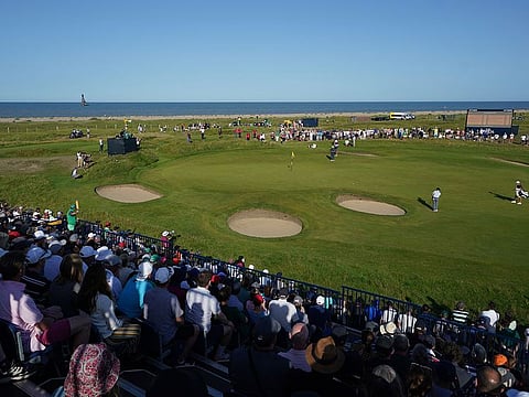 Open leader Louis Oosthuizen putts on the 12th green as Royal St George's bakes in the sun