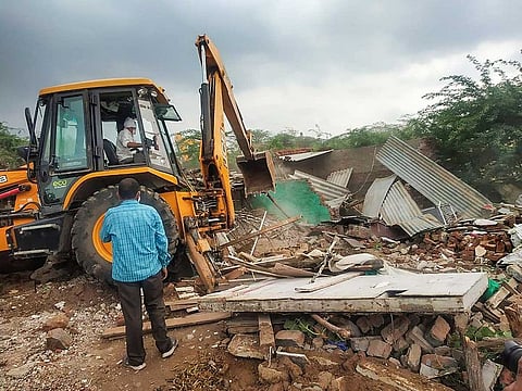 Municipal Corporation workers during demolition work at Khori village in Faridabad, Wednesday, July 14, 2021.