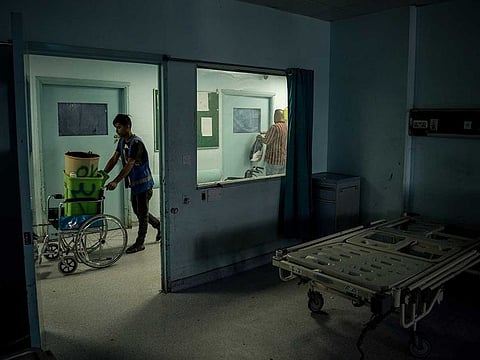 Imam Hussein Teaching Hospital workers move their equipment to Al-Nasiriya Teaching Hospital after the hospital's coronavirus ward caught fire, in Nasiriya, Iraq, Thursday July 15, 2021.