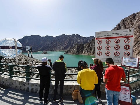 Visitors near Hatta Dam. Dubai Police have cautioned the public to make sure children don't go swimming in dams and climb dangerous mountains or cliffs.