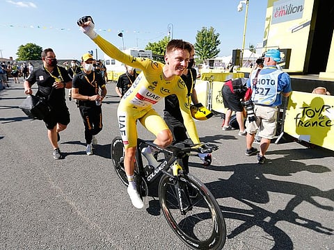 UAE Team Emirates rider Tadej Pogacar celebrates after stage 20 of the Tour de France