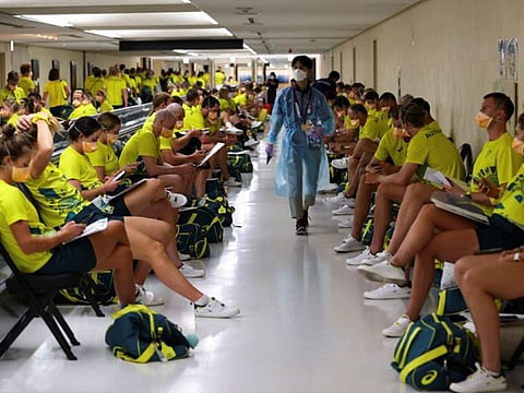 Members of Australian team wait to take the quantitative coronavirus disease (COVID-19) antigen test after arriving at Narita International Airport ahead of Tokyo 2020 Olympic Games, in Narita, east of Tokyo.