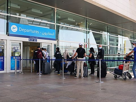 Travellers at Dubai International Airport.