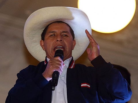 School teacher Pedro Castillo speaks to supporters from the balcony of the Peru Libre party headquarters in Lima, following the official proclamation of him as Peru’s president-elect on July 19, 2021.