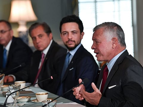 Jordanian King Abdullah II speaks as Jordan's Crown Prince Hussein looks on during a meeting with U.S. Secretary of State Antony Blinken at the State Department, in Washington, U.S., July 20, 2021.