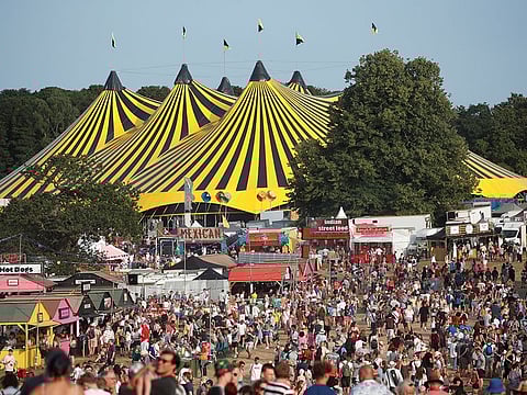 Festivalgoers enjoy the weather and stalls at Latitude Festival at Henham Park, Britain, July 22, 2021.