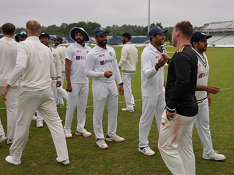 Indian cricket team members and County XI players exchange pleasantries after their tour game was agreed to be a draw in Durham on Thursday.