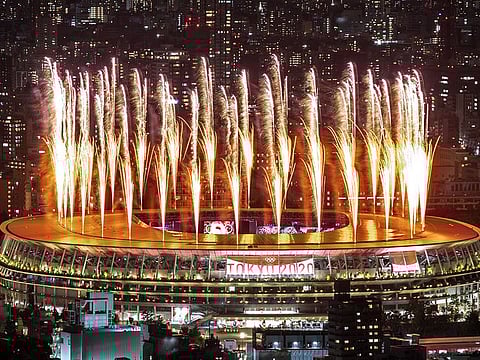 Fireworks light up the sky over the Olympic Stadium during the opening ceremony of the Tokyo 2020 Olympic Games, in Tokyo, on Friday.