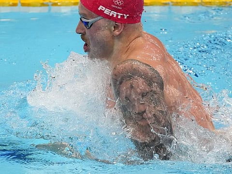 Adam Peaty, of Britain, swims the men’s 100-meter breaststroke at the 2020 Summer Olympics, in Tokyo, Japan.