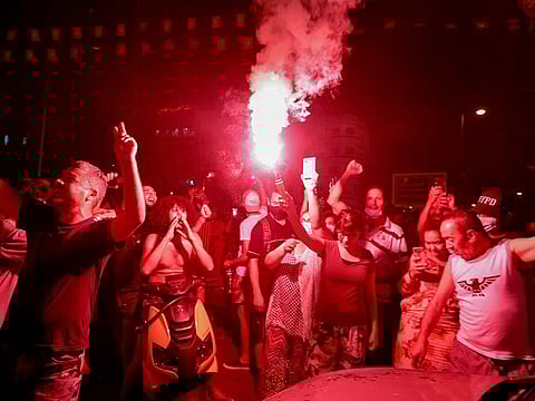 Supporters of Tunisia's President Kais Said gather on the streets as they celebrate after he dismissed the government and froze parliament, in Tunis, Tunisia July 25, 2021.