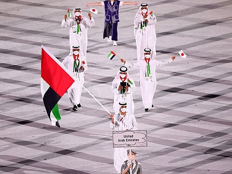 Yousuf Al Matrooshi carries the UAE flag at the Tokyo 2020 opening ceremony