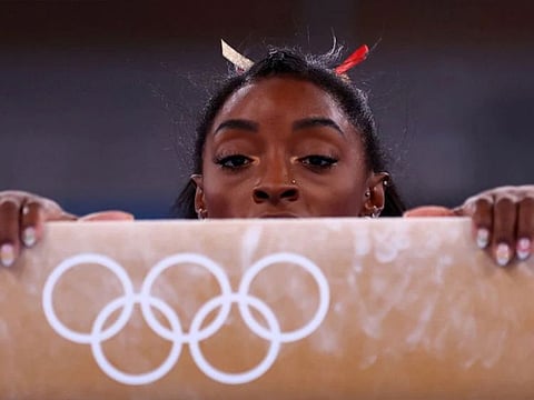 Simone Biles of the United States competes on the balance beam.