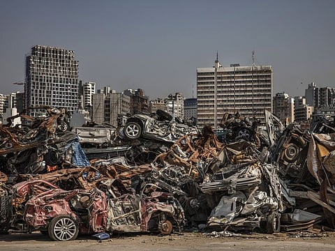 Damaged automobiles and scrap in the Port of Beirut July 19, 2021. The massive August 4 blast at the port killed about 200 people, injured thousands more, and damaged or destroyed 300,000 homes.