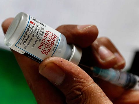 In this Tuesday, July 6, 2021 file photo, a health worker prepares a Moderna COVID-19 vaccine at a vaccination centre, in Lahore, Pakistan.