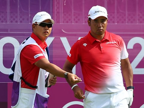Japan's Hideki Matsuyama (right), the Masters champion, admitted of experiencing the after-effects of Covid-19 on a hot and humid opening day in Tokyo.