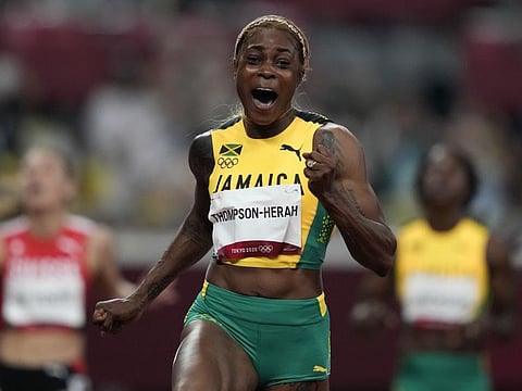 Elaine Thompson-Herah of Jamaica reacts as she wins the women's 100m final