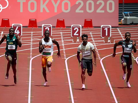 The UAE's Mohammed Al Hammadi, right, in action in the 100m