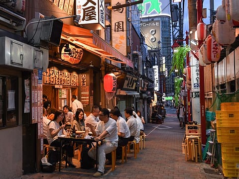 Customers at a bar in the Shinjuku district of Tokyo, Japan, on July 29, 2021. While the number of infections directly connected with the Olympics has so far been relatively low, Tokyo and its surrounding areas are experiencing their worst-yet virus wave.