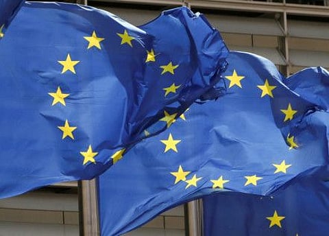 European Union flags flutter outside the EU Commission headquarters in Brussels. The bloc’s 27 member states must still vote unanimously for the list of people and entities to be sanctioned.