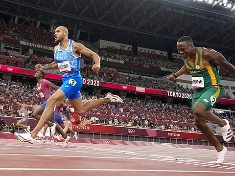 Lamont Jacobs of Italy celebrates after winning the men's the 100-metre final at the 2020 Olympics in Tokyo.