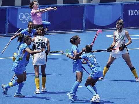 India's Vandana Katariya celebrates with teammates after scoring her hat-trick goal against South Africa