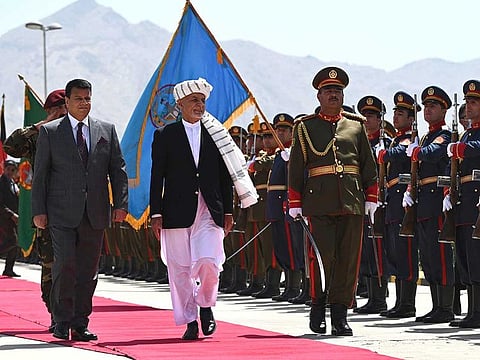 Afghanistan's President Ashraf Ghani (C) inspects the ceremonial guard of honour prior to a meeting at the Afghan Parliament house in Kabul on August 2, 2021.