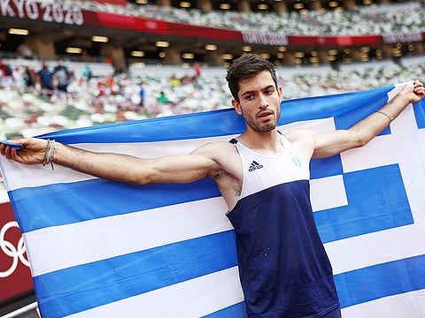 Miltiadis Tentoglou, of Greece, celebrates after winning men's long jump final at the 2020 Summer Olympics, on Monday, August 2, 2021, in Tokyo.