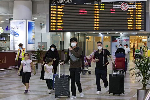 Expats, who are fully vaccinated against COVID-19, arrive at Kuwait international airport in Kuwait City on August 1, 2021.