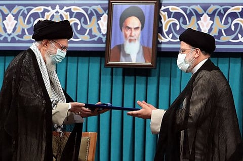 Iran's Supreme Leader Ayatollah Ali Khamenei and Ebrahim Raisi (right) during the inauguration ceremony of the President in Khamenei's office in Tehran on August 3, 2021.