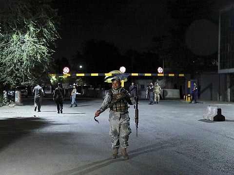 Afghan security personnel arrives at the site of a powerful explosion in Kabul, Afghanistan, Tuesday, Aug. 3, 2021.