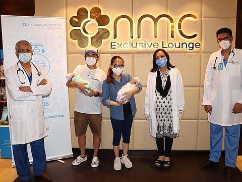 Mariecen Agillon and her husband with their twins and the doctors who made the delivery possible