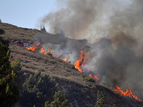 An Israeli fire truck is seen at a scene where fire broke out following a landing of a rocket that was fired at Israel from Lebanon, in Kiryat Shmona, Israel August 4, 2021.