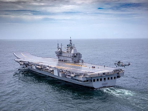 In this handout photo taken on August 4, 2021 and released by the Indian Navy, the Indigenous Aircraft Carrier (IAC P71) 'Vikrant' sets out as it commenced its sea trials from the naval dockyard in Kochi. (Photo by - / INDIAN NAVY / AFP) / RESTRICTED TO EDITORIAL USE - MANDATORY CREDIT "AFP PHOTO /Indian Navy " - NO MARKETING - NO ADVERTISING CAMPAIGNS - DISTRIBUTED AS A SERVICE TO CLIENTS
