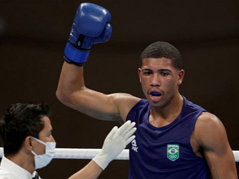Hebert Sousa of Brazil reacts after knocking down Oleksandr Khyzhniak of Ukraine during their final fight.
