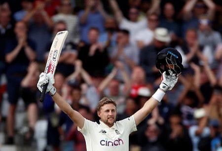 England's Joe Root celebrates his century against India.