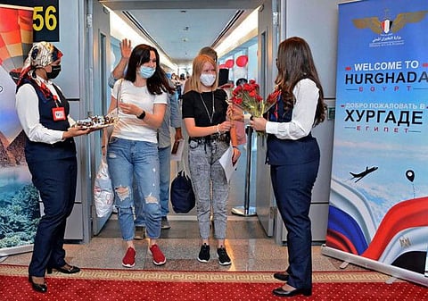 Russian visitors arrive in Egypt's Red Sea resort of Hurgada on August 9, 2021 on the first tourist flight since the October 2015 bombing of a Russian airliner, according to the Egyptian civil aviation authority.