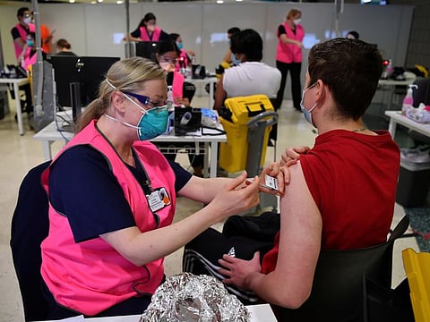 Year 12 students get the jab at a mass vaccination hub at Sydney Olympic Park on August 9, 2021.
