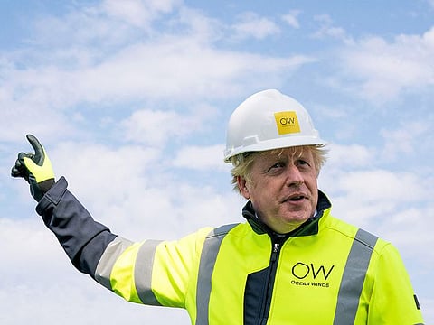 Boris Johnson gestures onboard the Esvagt Alba during a visit to the Moray Offshore Windfarm East, off the Aberdeenshire coast on August 5, 2021, the second day of his two-day visit to Scotland