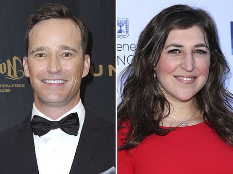 This combination photo shows Mike Richards, left, and Mayim Bialik.