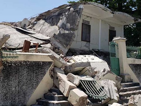 The residence of the Catholic bishop is damaged after an earthquake in Les Cayes, Haiti, Saturday, Aug. 14, 2021.