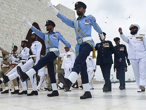 Pakistan's Army, Navy and Air Force soldiers march at the mausoleum of Pakistan founding father Muhammad Ali Jinnah during Pakistan's 75th Independence Day celebrations in Karachi on August 14, 2021.