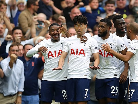 Tottenham Hotspur's Son Heung-min celebrates scoring his goal against Man City with his teammates.