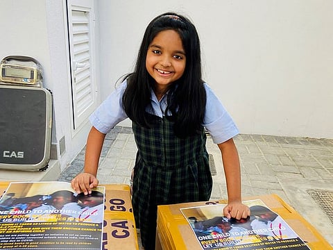 Isha with her consignment of books