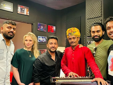 L To R : Playfield Entertainment team videographer Jibin Jose, special events coordinator Alina Khamitova, sound specialists and music lovers Dixit Dev and Harish Mathew and instrumentalist Neville George with Jhavar Khan (in red)