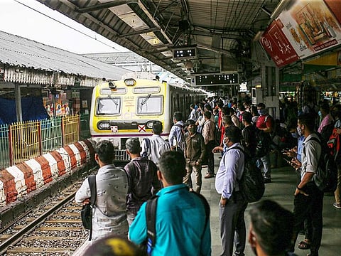 A train arrives at Dadar railway train station in Mumbai, India, on Monday, Aug. 16, 2021. Mumbai has restarted commuter train services for fully vaccinated residents.