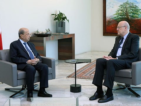 Michel Aoun with Mikati at the presidential palace in Baabda, east of the capital Beirut, on August 16, 2021.