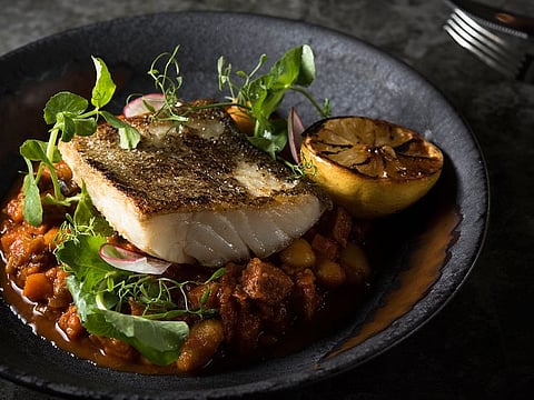 The pan-African menu of the dining hall takes culinary delights from various regions of the continent | Above: Bacalhau, a dried salted cod dish enjoyed in Angola.