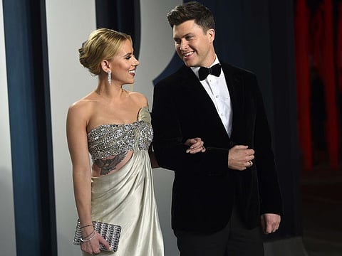In this Feb. 9, 2020 file photo, Scarlett Johansson, left, and Colin Jost arrive at the Vanity Fair Oscar Party in Beverly Hills, Calif.