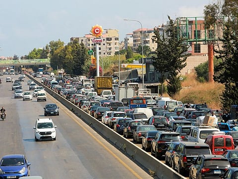 A view shows cars stuck in a traffic jam near a petrol station in Damour, Lebanon, August 13, 2021.
